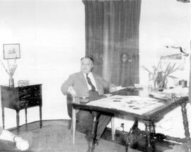 Wolfgang Pauli at a table